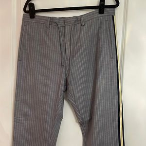 Light gray/White pinstripe trousers with yellow/black/white side tape